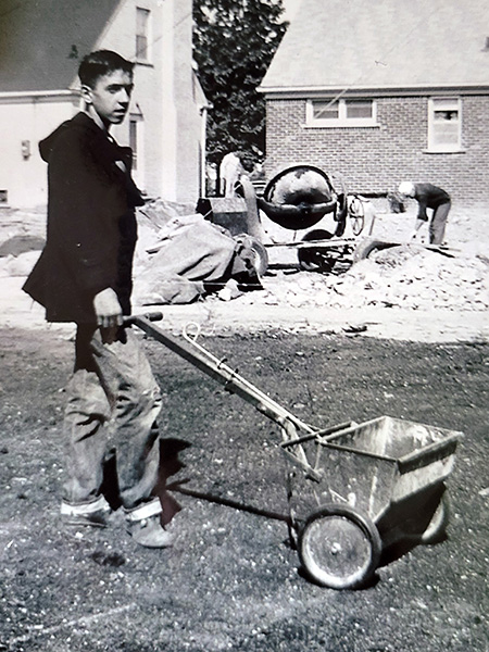 man using self-power spreader in 1960's