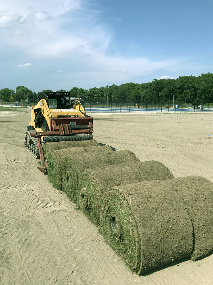 Large Rolls of Sod and Front Loader
